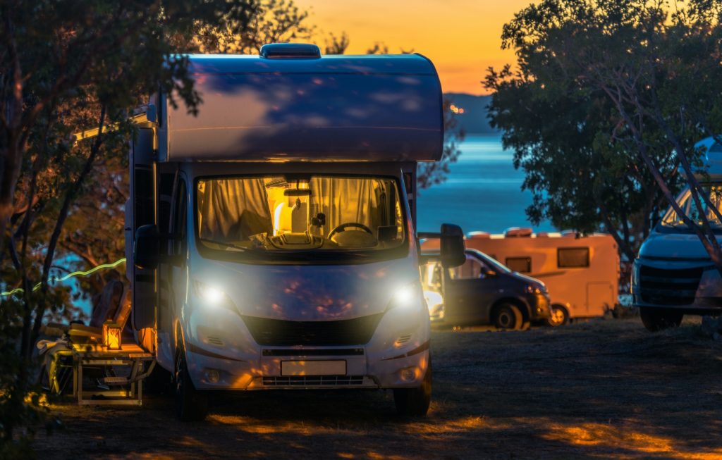 Scenic RV Park Campsite Sunset with Camper Vans